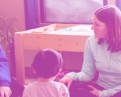 TBDSSAB Child Care and Early Years Programs header image: two child care workers sitting on the floor in circle time with several young children