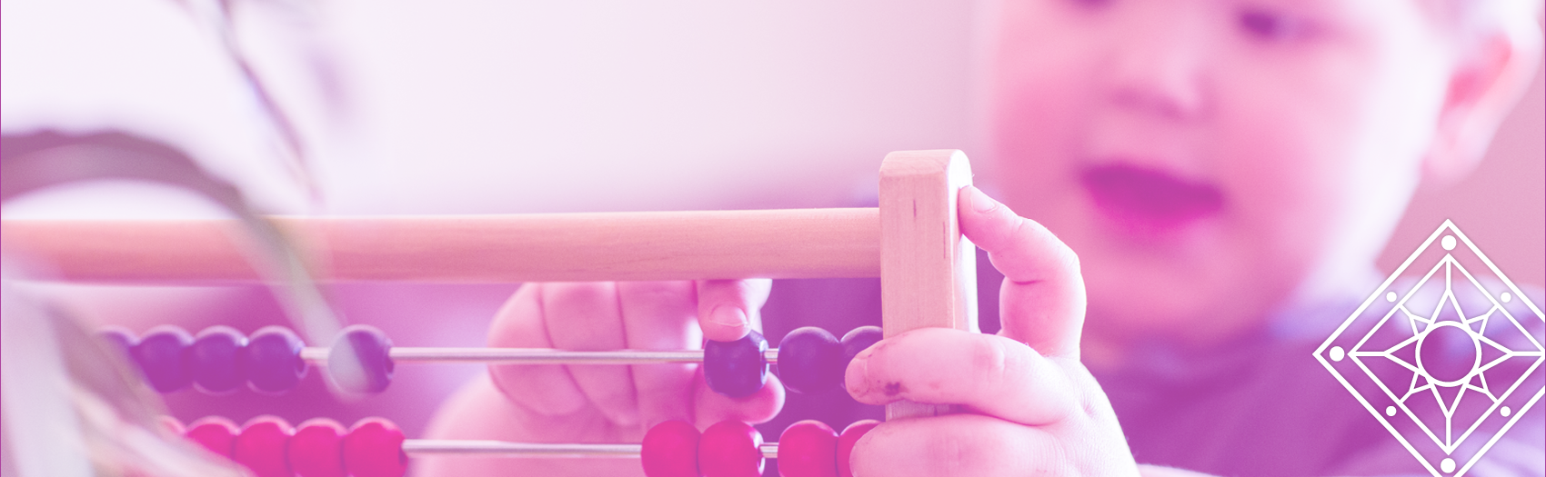 TBDSSAB Child Care and Early Years Programs header image: a closeup of a young child playing with a colourful abacus / wooden bead toy.