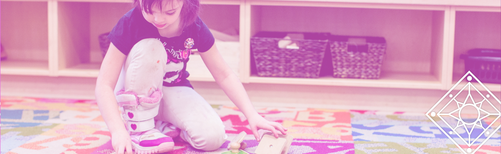 TBDSSAB Child Care and Early Years Programs header image: a young child working on a puzzle on a play mat in a child care centre